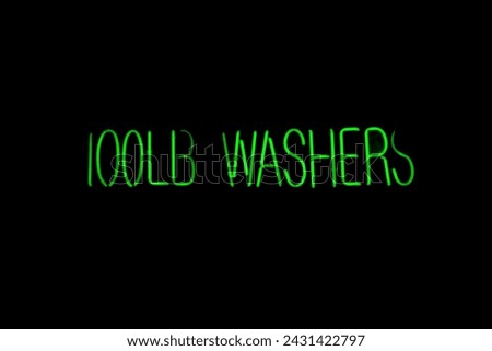 Neon Sign. Neon Sign in a Laundry Mat. Glowing Neon. 100LB Washers. Neon Lettering. 100Pound Washers Sign. Set of informational signs. Night bright signboard. Glowing light banner. Glowing Sign. Gas. 