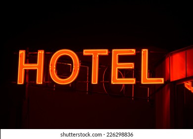 Neon sign of a small hotel.