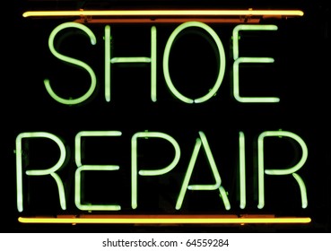 Neon Sign In Window Of Shoe Repair Shop