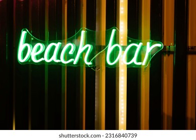 Neon signboard beach bar close-up. - Powered by Shutterstock