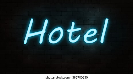 neon sign(hotel) on brick wall. night time. 
