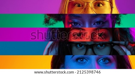 Neon stripes, loines. Closeup human eyes on multicolored background in neon light. Collage made of cropped faces of male and female models. Diversity. Concept of emotions, media, sales, advertising.