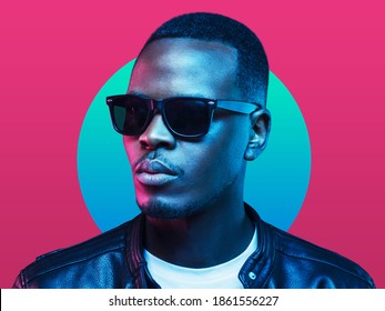 Neon studio portrait african american man wearing sunglasses   leather jacket isolated pink background