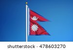 Nepal flag waving against clean blue sky, close up, isolated with clipping path mask alpha channel transparency