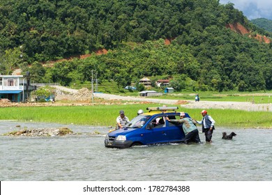 Nepal, Pame Village, July Of 2020: The Car Got Stuck In The Middle Of Overflowed River During Rain Season In Pame Village, Near Pokhara City, Nepal