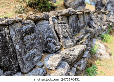 Nepal sacred stones mani with mantra written and carved on the surface. Prayer stones shire on the mountain trekking path on Everest Base Camp trek. Nepali buddhist mantra Om Mani Padme Hum on rock - Powered by Shutterstock
