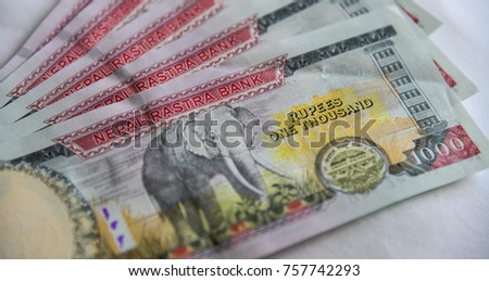 Nepalese banknotes (NPR) 1000 Rupees. The issuance of the currency is controlled by the Nepal Rastra Bank, the central bank of Nepal.