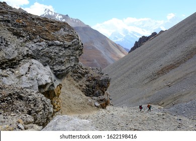 Nepalese Porters Carrying Luggage Of Tourists During Climbing From Base Camp In Thorong Phedi To High Camp Around Thorong La Pass In Himalaya, Nepal. During Trekking Around Annapurna