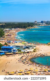 NEPTUN JUPITER, ROMANIA - July 30, 2014 Birdseye Panoramic View Of A Crowded Beach And Unidentified People In The Waves From The Top Of Capitol Hotel