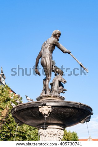 Neptune statue and fountain in Gdansk, Poland, dating from 1549, on blue sky, contaminated with pigeon droppings