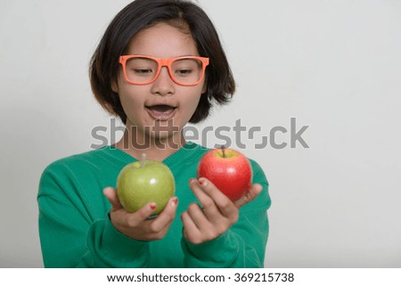 Nerd girl holding apple