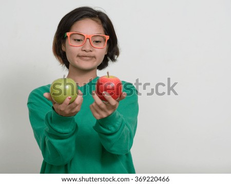 Nerd girl holding apples