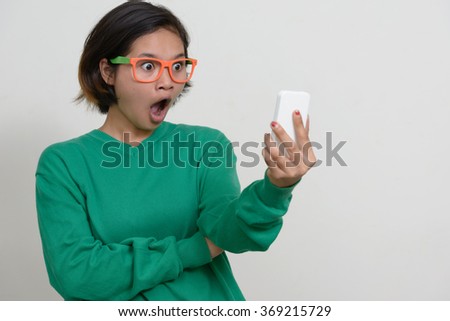 Nerd girl using mobile phone