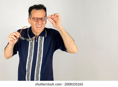 Nerd Guy Trying Two Pair Of Glasses To Focus Far Away. 