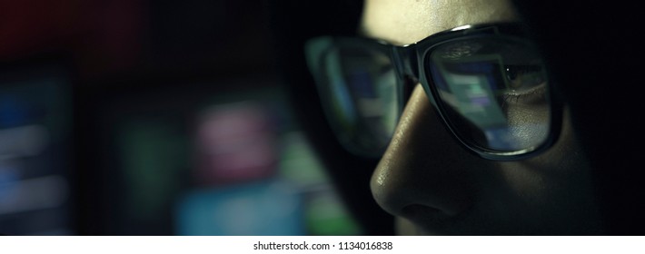 Nerd Hacker With Glasses Working With A Computer In The Dark, Cybersecurity Concept