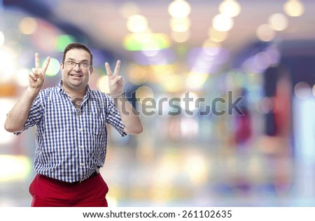 nerd man peace gesture in a shopping center