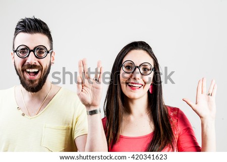 nerd man and nerd woman showing the live long and prosper salutation