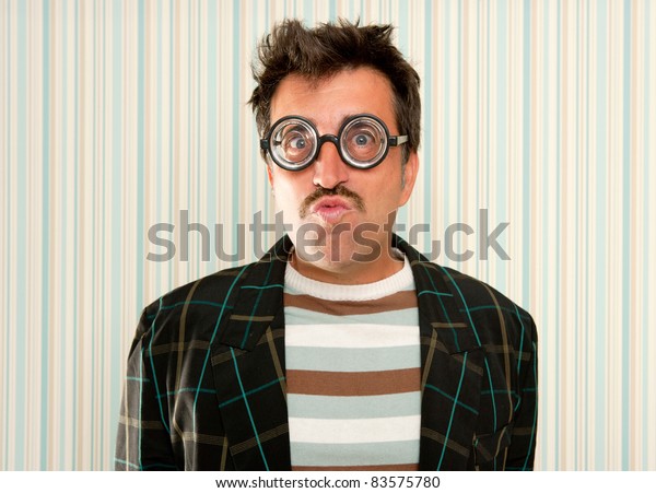 nerd silly myopic man with glasses doing funny\
expression with retro\
mustache