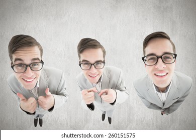 nerdy businessman showing thumbs up against white and grey background - Powered by Shutterstock