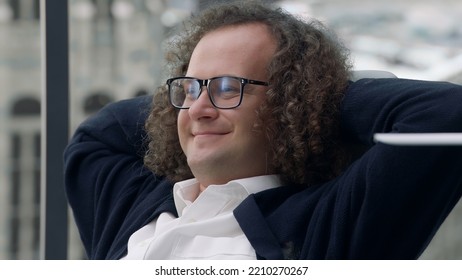 Nerdy Looking Manager Enjoying Promotion, Sitting At His New Working Desk