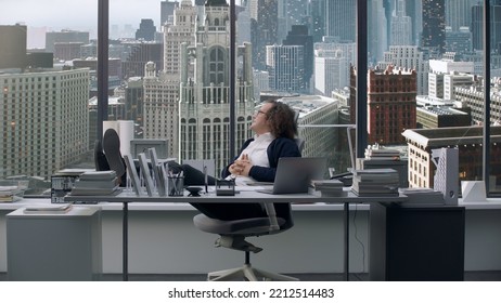 Nerdy Looking Manager Enjoying Promotion, Sitting At His New Working Desk