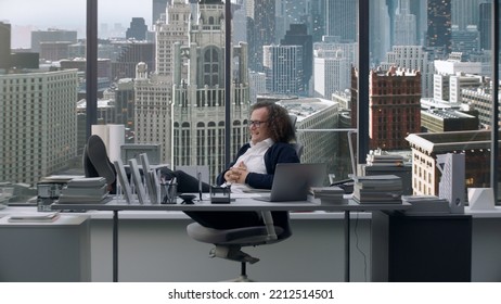 Nerdy Looking Manager Enjoying Promotion, Sitting At His New Working Desk