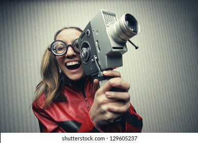 Nerdy Woman Using Old Fashioned Cine Camera