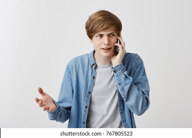 Nervous Angry Guy With Serious Expression, Having Phone Conversation, Frowning Face, Gesturing Actively, Discussing Complicated Issues Of Relationships. Negative Reaction, Modern Communication