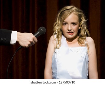 Nervous Beauty Pageant Contestant With Microphone