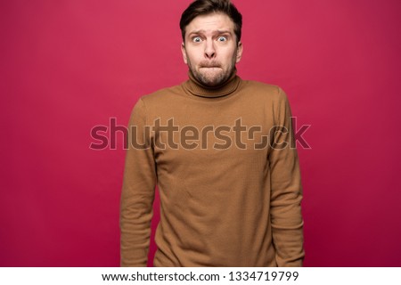 Nervous embarassed man, looks worried before visiting doctor or dentist. Anxious concerned male student feels anxiety before passing course or diploma paper, afraid of difficult questions