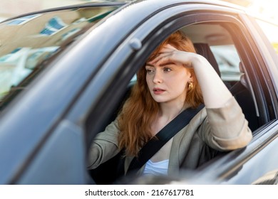 Nervous female driver sits at wheel, has worried expression as afraids to drive car by herself for first time. Frightened woman has car accident on road. People, driving, problems with transport - Powered by Shutterstock