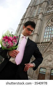 Nervous groom waiting for his bride at church.