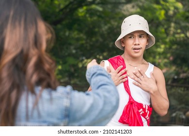 A Nervous Man Is Caught Off Guard By The Unfounded Accusations Of Another Young Lady. Mistaken Identity. Outdoor Scene.