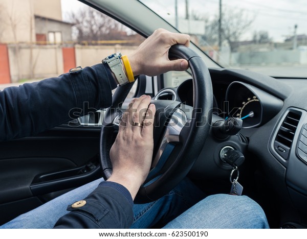 Nervous man driver pushing
car horn