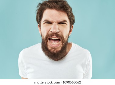 A nervous man screams and scolds someone                               - Shutterstock ID 1090563062
