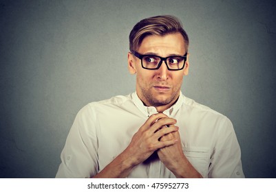 Nervous Stressed Young Man Student Feels Awkward Looking Away Sideway Anxiously Craving Something Isolated Gray Wall Background. Human Emotion Face Expression Feeling Body Language