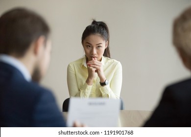 Nervous Young Asian Job Applicant Wait For Recruiters Question During Interview In Office, Worried Intern Or Trainee Feel Stressed Applying For Open Position, Meeting With Hr Managers. Hiring Concept