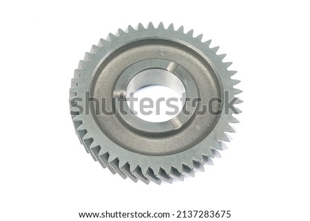 Nested gears. Copper and silver cylindrical gear vehicle parts. Old and new gear cards. Silver shining car executive parts. White screws on the back. giant gear wheel,