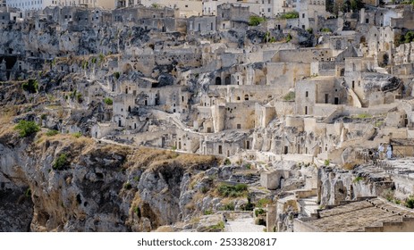 Nestled in the hills of Puglia, Matera Italy boasts a rich history with its intricate architecture carved into stone. - Powered by Shutterstock