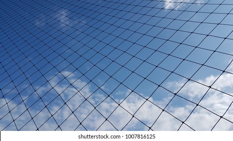 Net to catch balls around a football field , on clear sky background. - Powered by Shutterstock