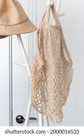 Net Cotton Reusable Grocery Tote Bag Hanging On A Clothes Stand.