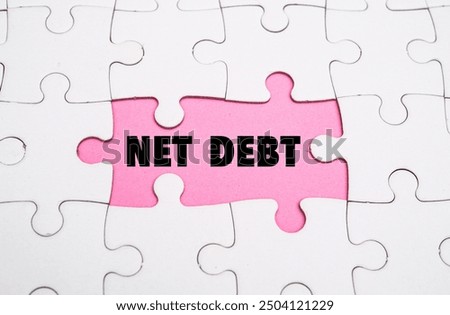 NET DEBT word alphabet letters on puzzle