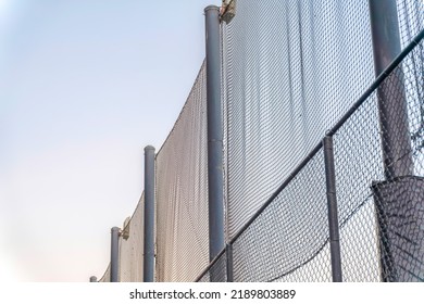 Net Fence Barrier With Metal Bar Support In San Francisco, California. There Is A Metal Fence Below The Net Barrier Above With Metal Bars Support.