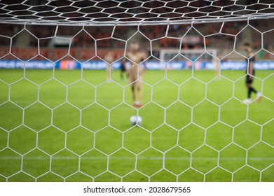 Net In The Football Goal Penalty Shootout In The Background.