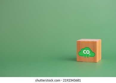 Net Zero And Carbon Credit With Wood Cube Block Icon Co2 Eco On Green Background.