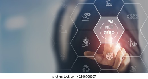 Net zero and carbon neutral concept. Net zero greenhouse gas emissions target. Climate neutral long term strategy. Businessman touching on net zero icon with decarbonization icon on smart background. - Shutterstock ID 2168708887