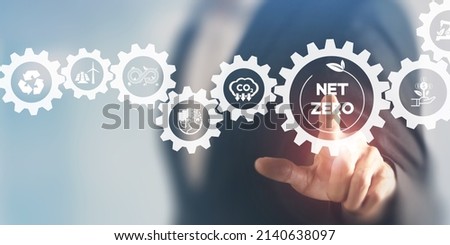 Net zero and carbon neutral concept. Net zero greenhouse gas emissions target. Climate neutral long term strategy. Businessman touching on net zero icon with decarbonization icon on smart background.