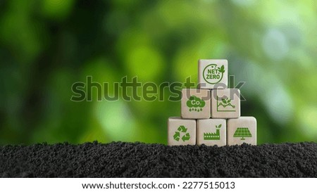 net zero and carbon neutral concept net zero emissions target Long-term, climate-neutral strategy with a wooden block on the green icon in the center of the net and a green icon on the background