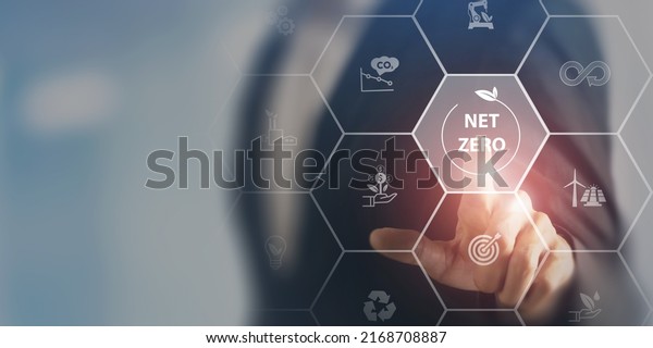 Net zero and carbon neutral concept. Net zero\
greenhouse gas emissions target. Climate neutral long term\
strategy. Businessman touching on net zero icon with\
decarbonization icon on smart\
background.