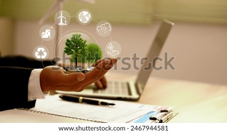 NET ZERO Environment. Green earth ball in hand in green forest background. Ecosystem. Earth Day. Forest conservation CSR ESG. 